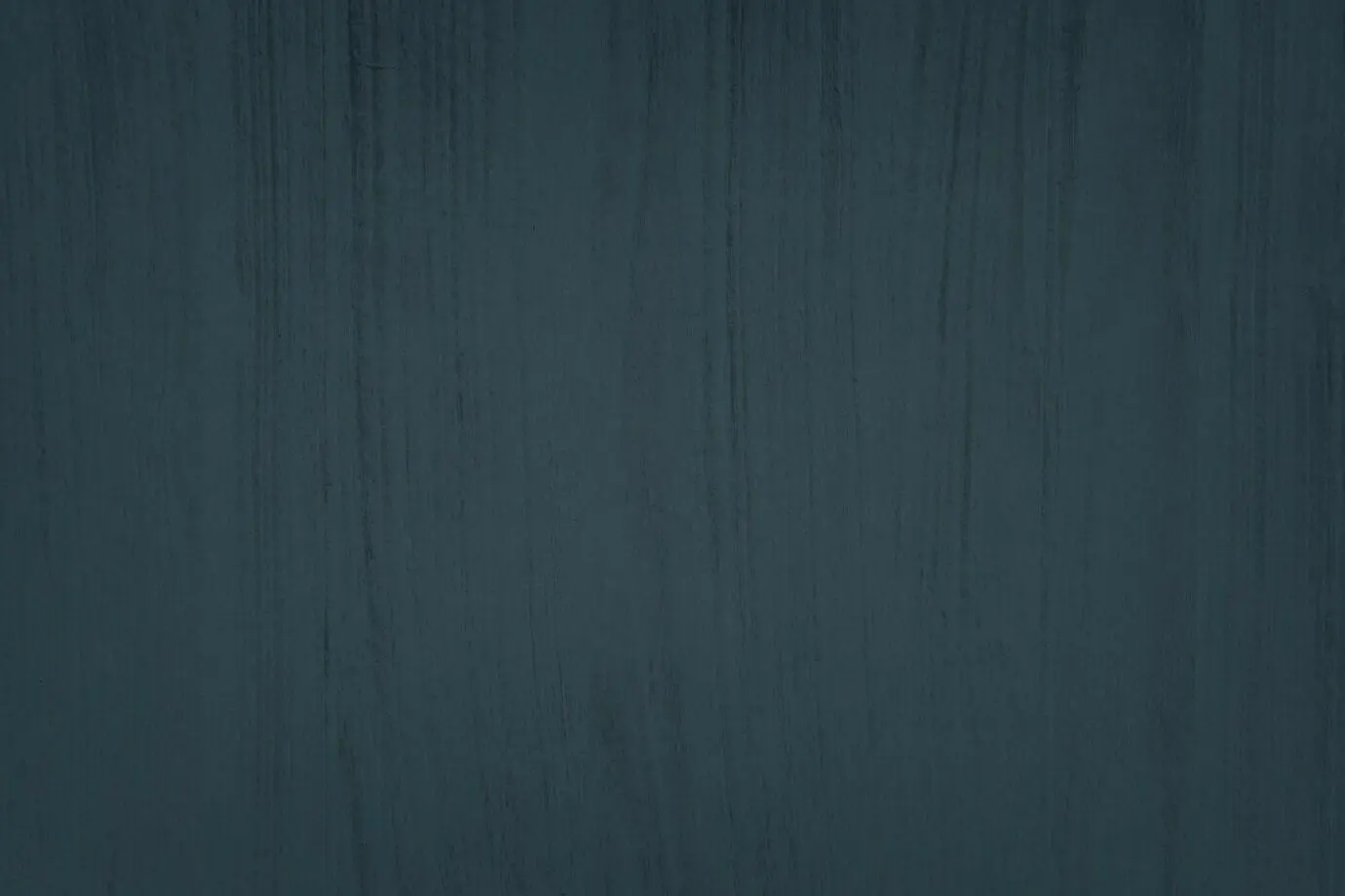 Strukturierter Hintergrund einer gestrichenen massiven Betonwand